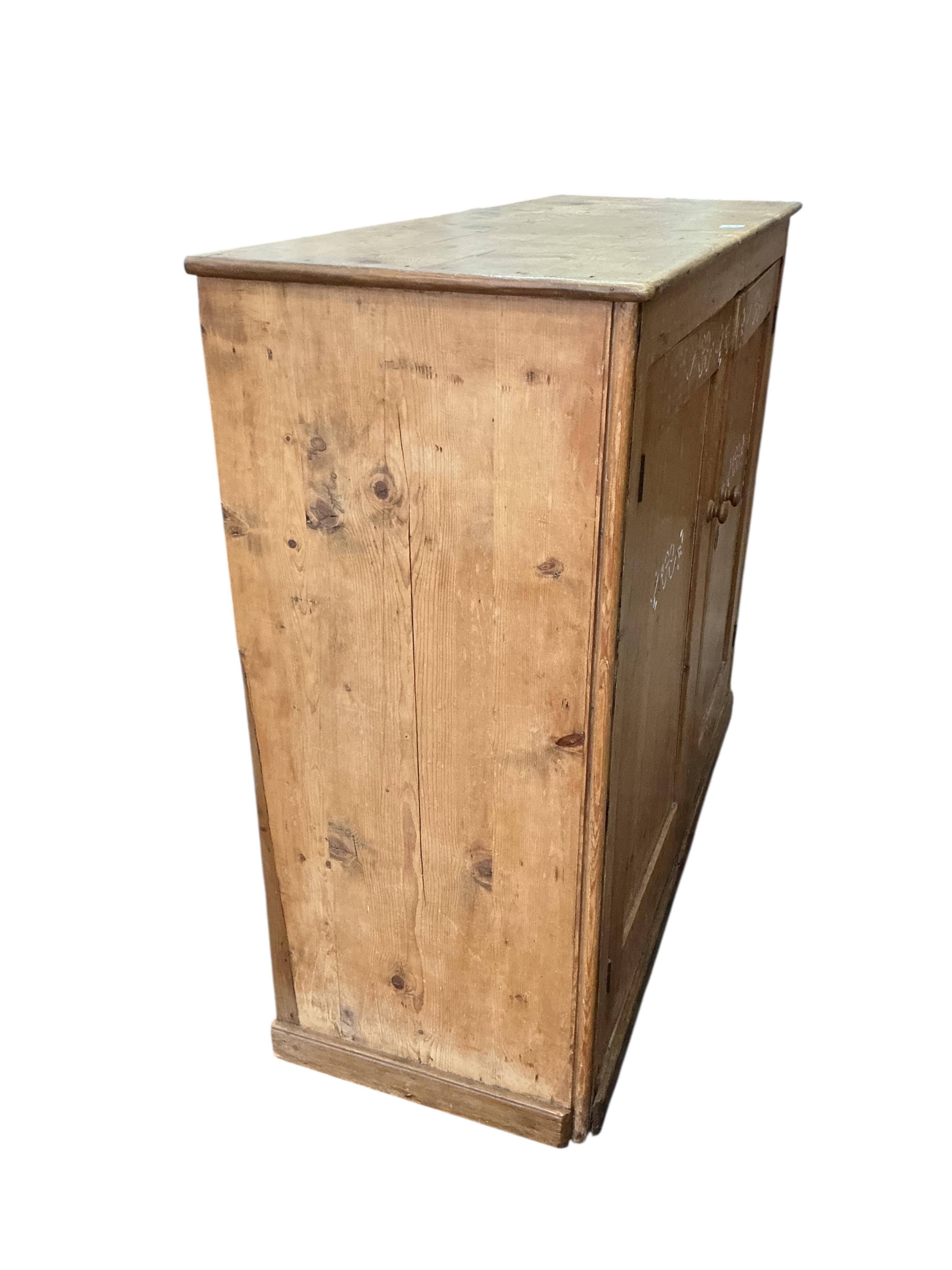 A Victorian pine side cabinet, width 131cm, depth 49cm, height 111cm